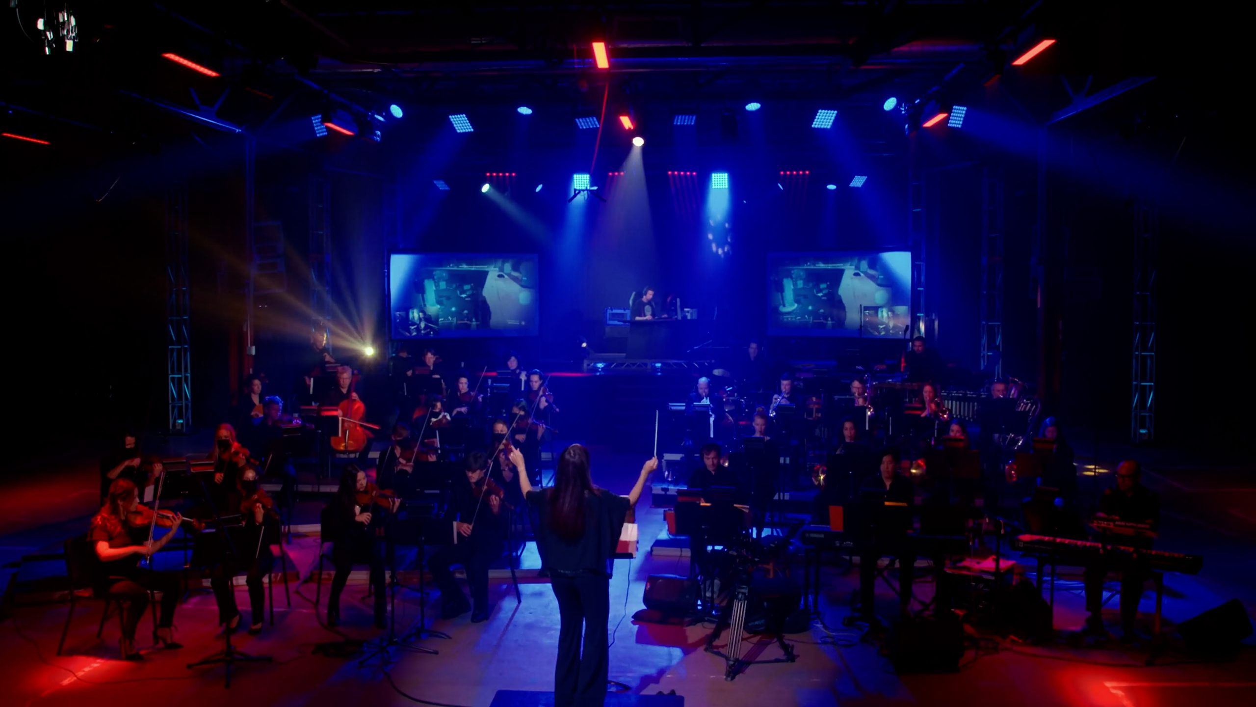 Orchestra performing under stage lighting at Intel Gamer Days event